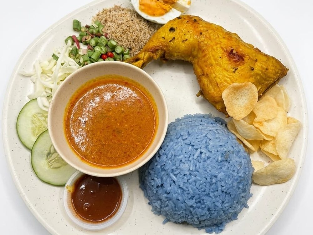 Nasi Kerabu with blue butterfly-pea rice