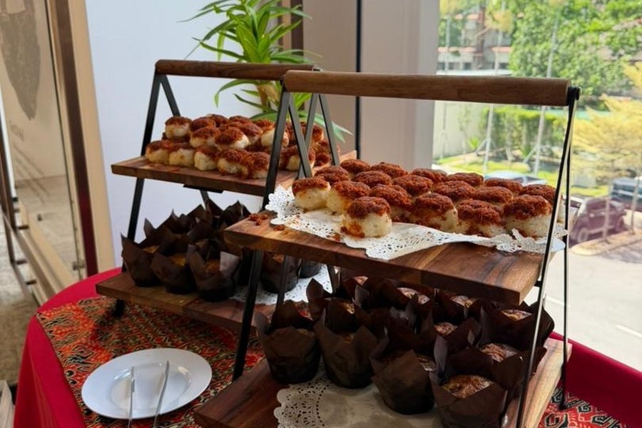 Tiered display of assorted Malay desserts and kuih for an event